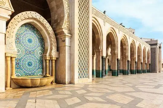 Courtyard and arches of the Hassan II Mosque in Casablanca, Morocco | Proper Morocco Tours